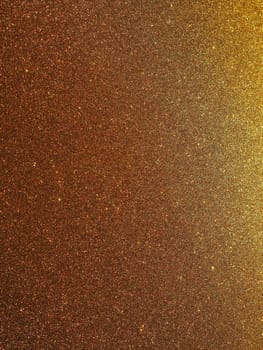 Bokeh light of gold glitters. Golden glitter texture background. Sparkling glitter wrapping paper with sequins and sparkles. Festive golden bokeh and glitter. Beautiful background