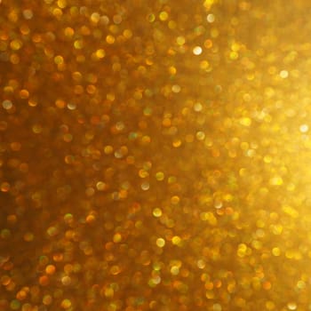 Bokeh light of gold glitters. Golden glitter texture background. Sparkling glitter wrapping paper with sequins and sparkles. Festive golden bokeh and glitter. Beautiful background