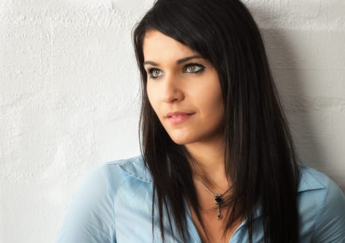 a portrait of a thoughtful girl with black hair