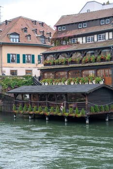 Strasbourg, water canal in Petite France area. timbered houses and trees in Grand Ile. Alsace, France.