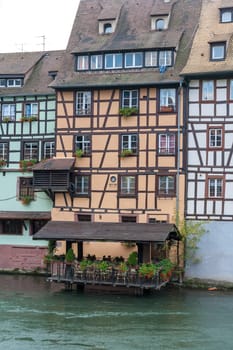 Strasbourg, water canal in Petite France area. timbered houses and trees in Grand Ile. Alsace, France.