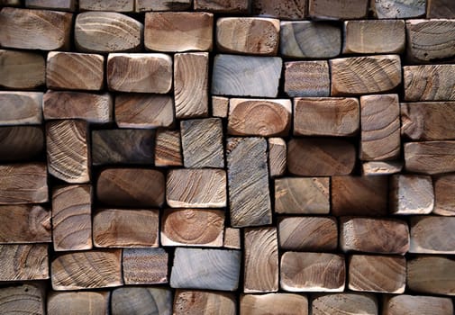 A texture of wood. Many stacked wooden slats from the front side.