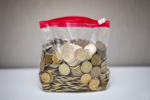 A bag full of different coins of the euro currency.