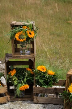 A festive decoration with beautiful yellow sunflowers.