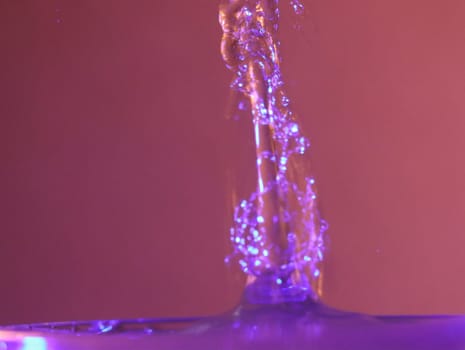 Drop of water colliding when it bounces and forming a palm tree