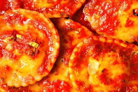 italian ravioli in tomato sauce food background