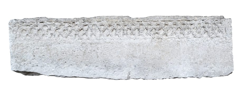front view closeup of large long antique plaque of stone carved with weathered fading pattern and ragged edges isolated on white