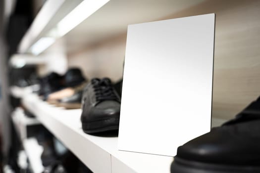 perspective view of point of sale empty shelf sign poster holder mockup in retail shoe store window