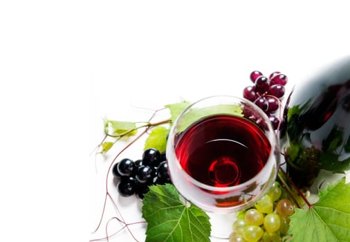 Top view of glass of red wine and bottle with grape vine isolated over white background. Wine tasting border design banner. Wine art shop and winery concept.
