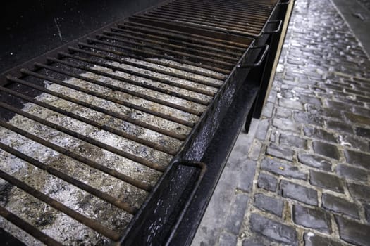 Detail of old abandoned metal grill, grill meat on the street