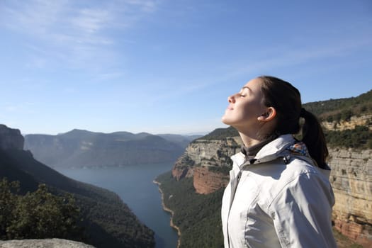 Profile of a hiker breathing in a landscape