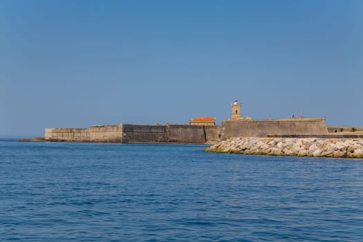 Saint Julian Fortress (Forte Sao Juliao da Barra) with lighthouse tower, beach of Carcavelos, Portugal