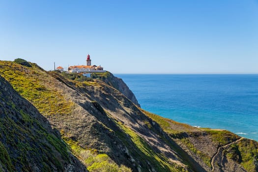 Lighthouse at Cape Roca (Cabo da Roca), most western point of Europe at coast of Atlantic Ocean in Portugal.