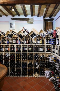 Montalcino, Italy - September 12, 2022: Interior of a wine shop in Montalcino ,Tuscany, Italy. Montalcino is famous for its Brunello di Montalcino wine.