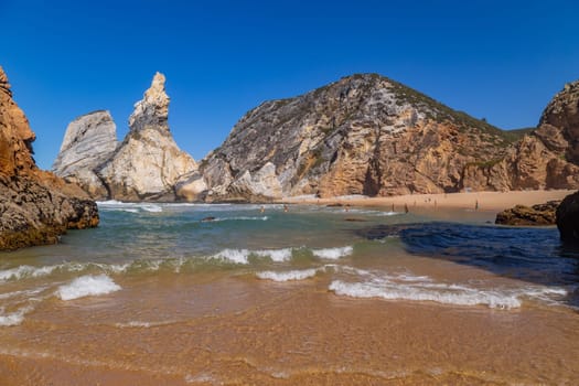 Sintra, Portugal: 22 October 2022 - Praia da Ursa (Ursa Beach) with people, in Sintra near Lisbon in Portugal.