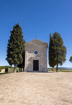 Pienza, Italy - September 12, 2022: Capella Di Vitaleta in countryside between San Quirico and Pienza in Val d Orcia Tuscany. Italy