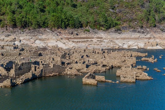 Geres, Portugal: 13 August 2022: People at the old ruins of Vilarinho das Furnas, located in Campo de Geres, Terras de Bouro, on margins of River Homem