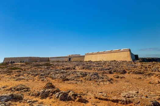 Sagres, Portugal: 2022 August 17: People walking through the Fortaleza de Sangres in the Algarve, Portugal in summer.