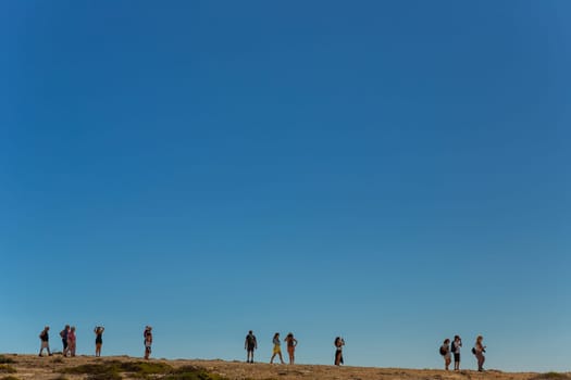 Sagres, Portugal - August 25, 2022: People at the cliff in Sagres village in Algarve, Portugal
