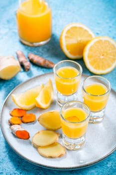 Boosting immune system - homemade healthy Ginger Lemon Turmeric Shot with ingredients