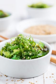 Wakame seaweed salad with sesame seeds. Traditional Japanese food.