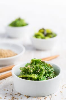 Wakame seaweed salad with sesame seeds. Traditional Japanese food.