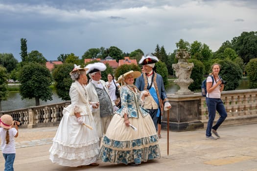 Moritzburg, Germany - AUG 23, 2020. Tourists have the opportunity to dress up in baroque costumes and experience a tour of the castle with dancing and sparkling wine.