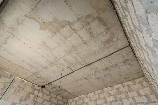Construction of an individual residential building, view of the monolithic reinforced concrete ceiling in the room