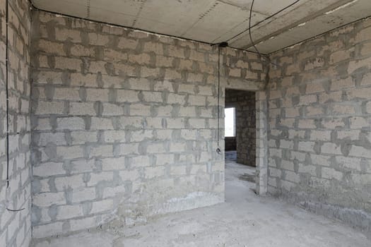 Construction of an individual residential building, view of the walls of the room, a doorway in the wall