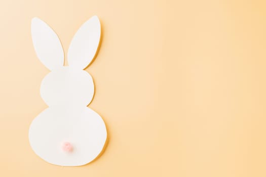 Easter Day Concept. Above overhead handmade white paper rabbit cutting isolated on pastel background with copy space for your text, Happy Easter Bunny holiday, Banner design for web