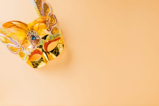 Happy Purim carnival decoration. Jewish Purim and Mardi Gras in Hebrew, celebration holiday background banner design, Golden venetian ball mask, carnival mask isolated on pastel background