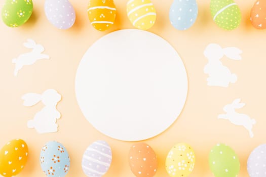 Overhead easter eggs with rabbit paper cut and circle white paper isolated on pastel background, Funny decoration paper round blank, Happy Easter Day, Creative banner web design holiday background