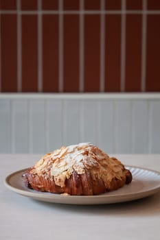 Freshly baked French croissant served in coffee shop, stock photo