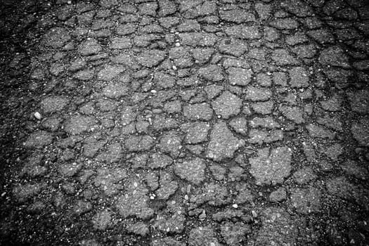 Detail of old abandoned road in the city, ruin