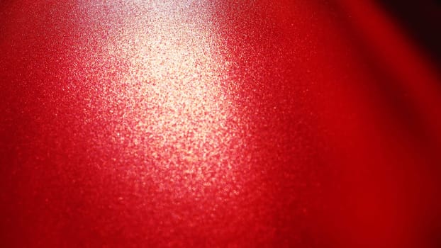 Diagonal rays of light on a red or scarlet background. Blurred abstract background light effect, light leaks. Side surface illumination. Parallel and asymmetric lines or stripes of light at an angle