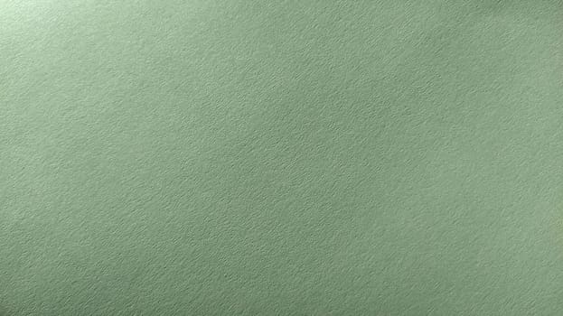 A sheet of light green paper with vignetting at the bottom. Calm green with fine paper texture. Soothing interior color.