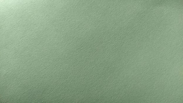 A sheet of light green paper with vignetting at the bottom. Calm green with fine paper texture. Soothing interior color.