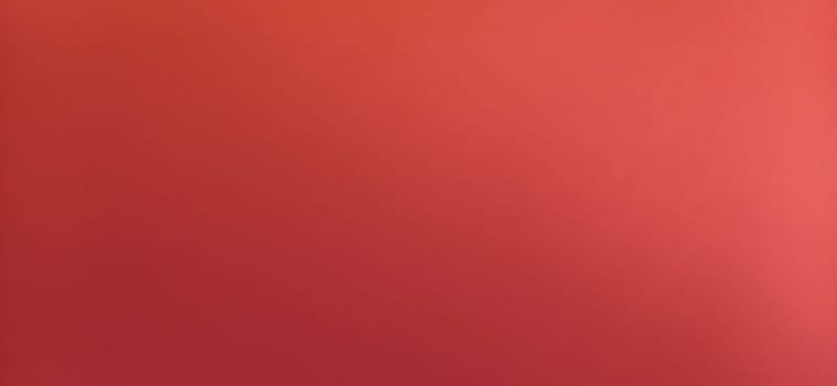 Red beautiful bright background. Color gradient depending on the light. To the left - dark red, to the right - the hue brightens. Scarlet uneven color. Sheet of colored paper with natural light.