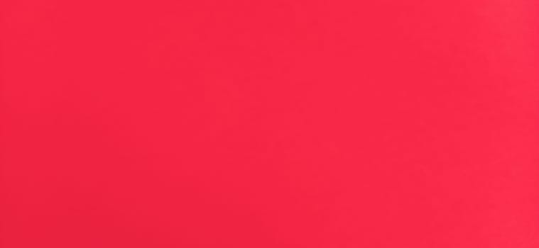 Red beautiful bright background. Scarlet uneven color. Sheet of colored paper.