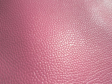 pink leather. Material for fashion accessories, for sewing leather and suede products, furniture upholstery. Natural leather texture.
