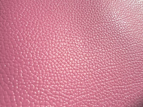 pink leather. Material for fashion accessories, for sewing leather and suede products, furniture upholstery. Natural leather texture.