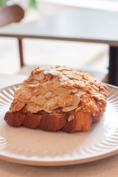 Freshly baked French croissant served in coffee shop, stock photo