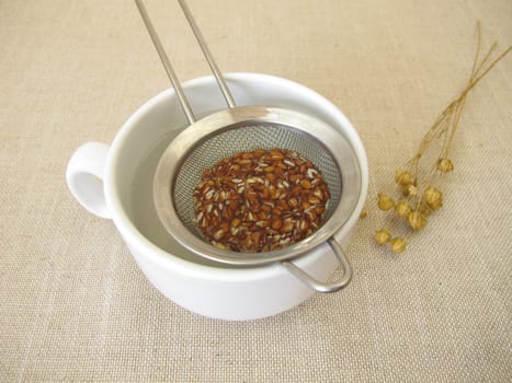Flaxseed tea, a cup of tea from brown flax seeds