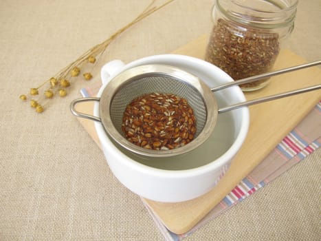 Flaxseed tea, a cup of tea from brown flax seeds