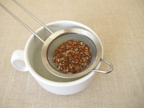 Flaxseed tea, a cup of tea from brown flax seeds