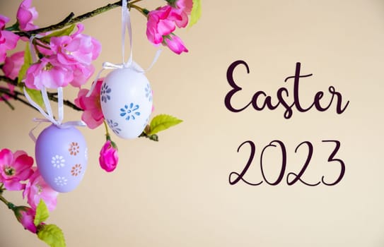 Beautiful Easter Egg Decoration With Spring Flowers. English Text Easter 2023. Seasonal Easter Holiday Greeting Card.