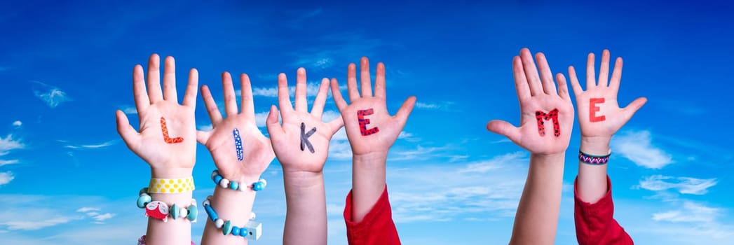 Children Hands Building Colorful English Word Like Me. Blue Sky As Background