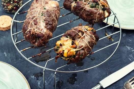 Beef meat rolls stuffed with mushrooms. Top view. Copy space