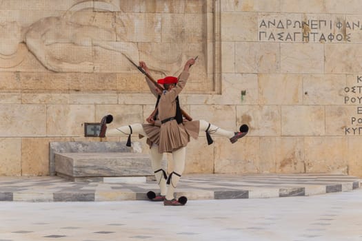 ATHENS, GREECE - MAY 06 2022: Presidential ceremonial guards - Evzones at the Tomb of the Unknown Soldier in front of the Greek Parliament, Athens, Greece