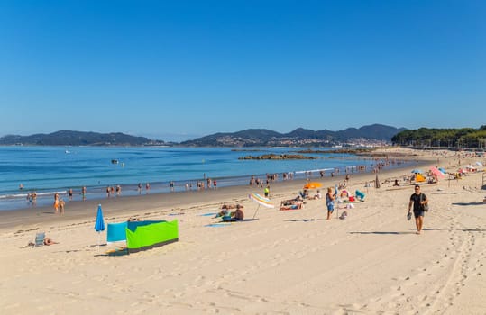 Vigo, Spain - July 27, 2022: People in Samil beach in a summer day, Vigo. Spain